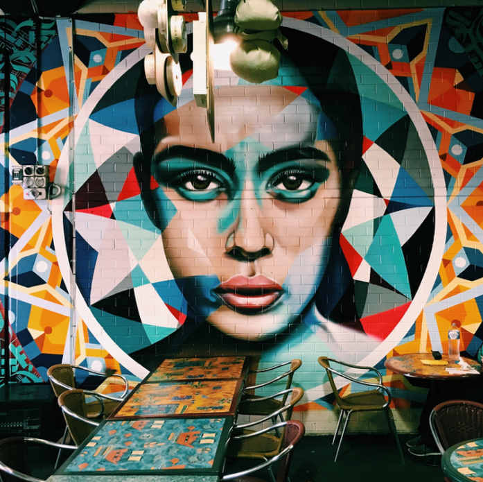 A graffiti mural of a face